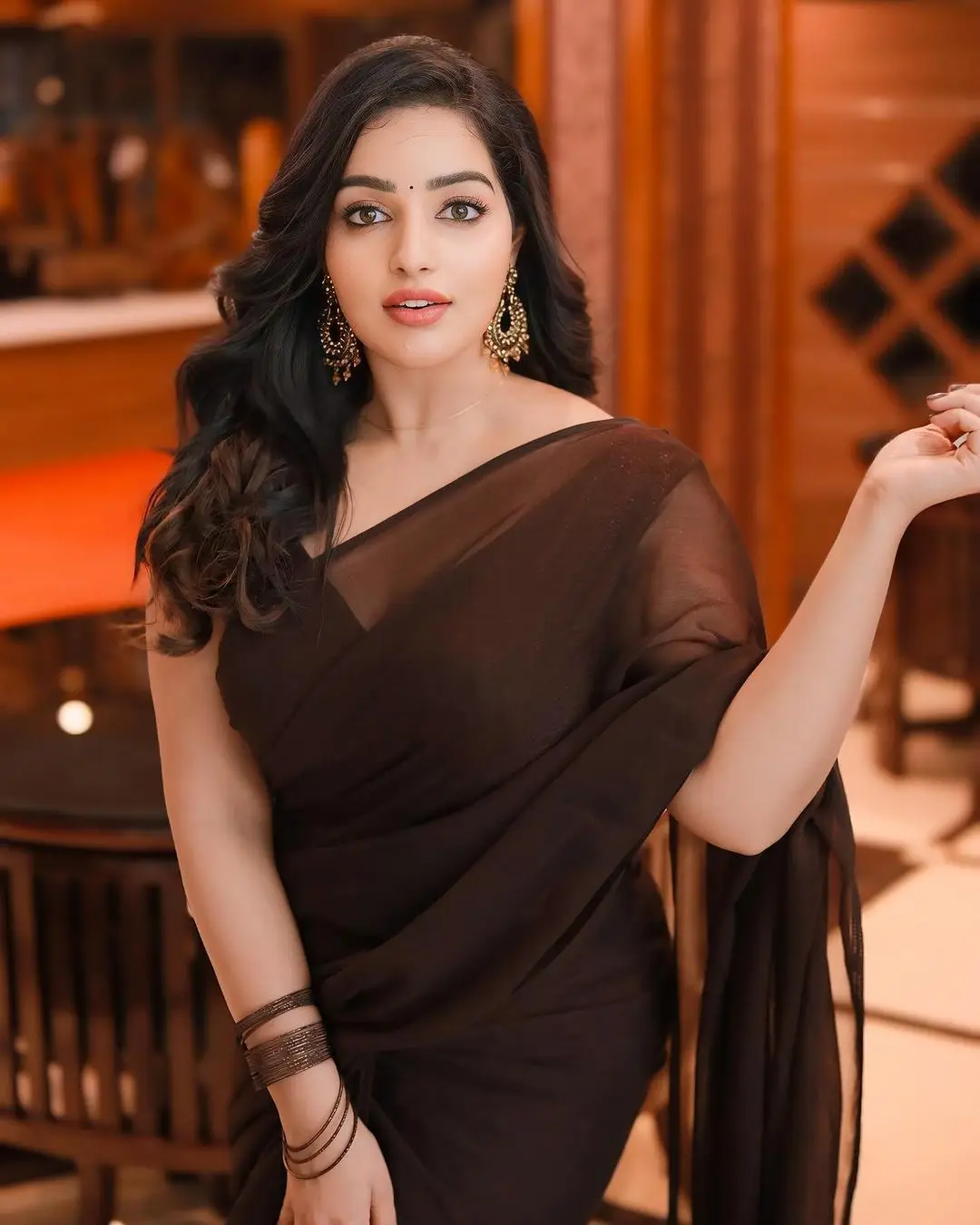 malayalam girl malavika menon in black saree sleeveless blouse